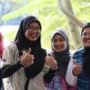 Women giving thumbs up